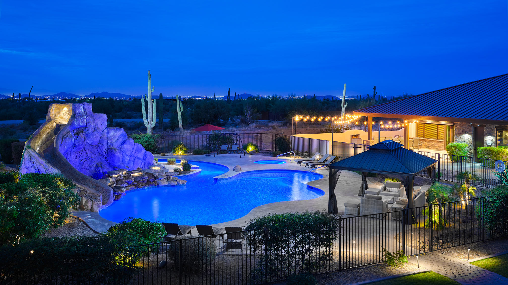 Hospitality photography by Warren Diggles. Pool and pool house dusk at HÓZHÓ Scottsdale.