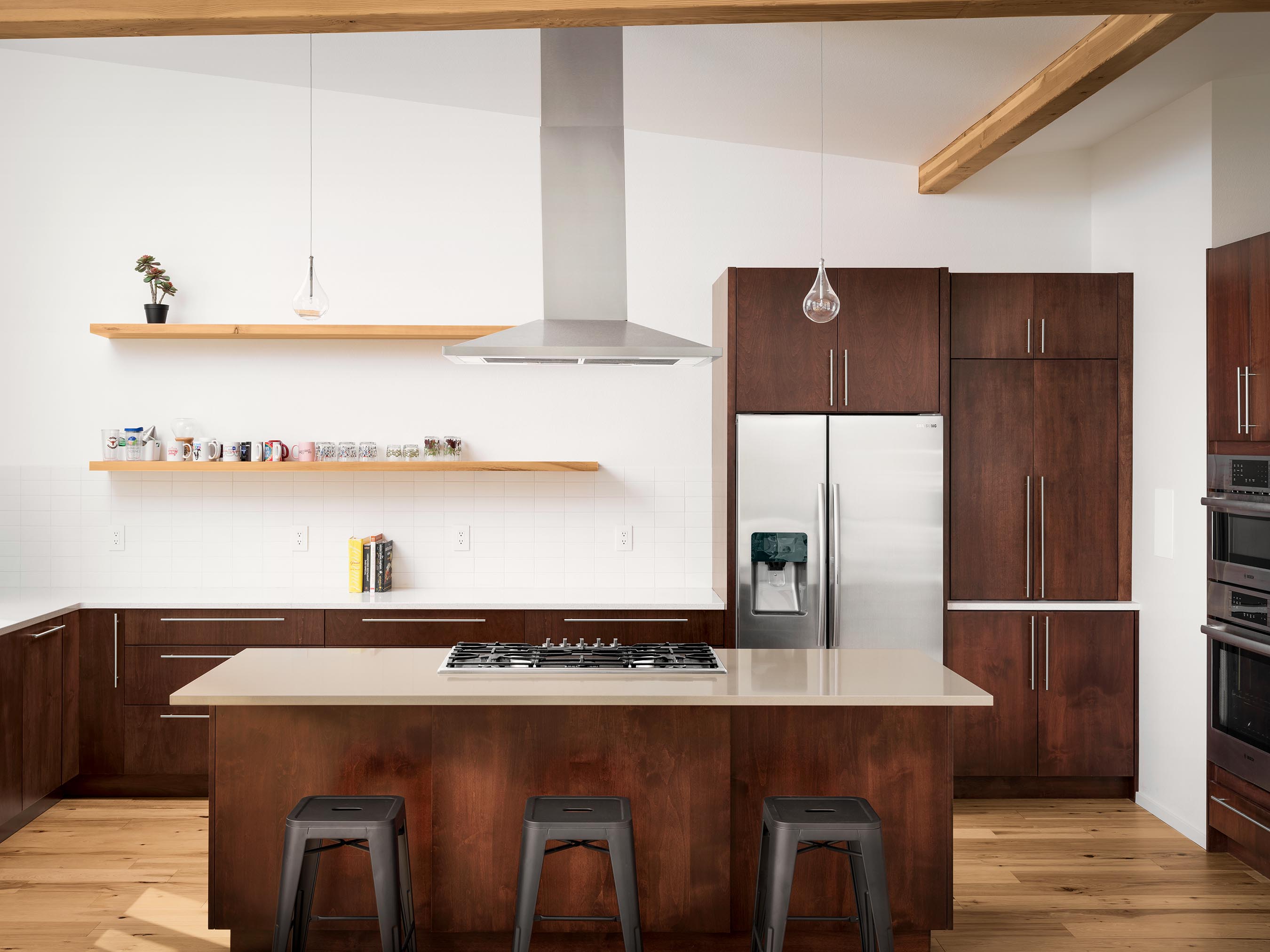 Residential architecture photography by Warren Diggles. 1 point perspective of simple modern kitchen design. New home project by Bas1s Architecture.