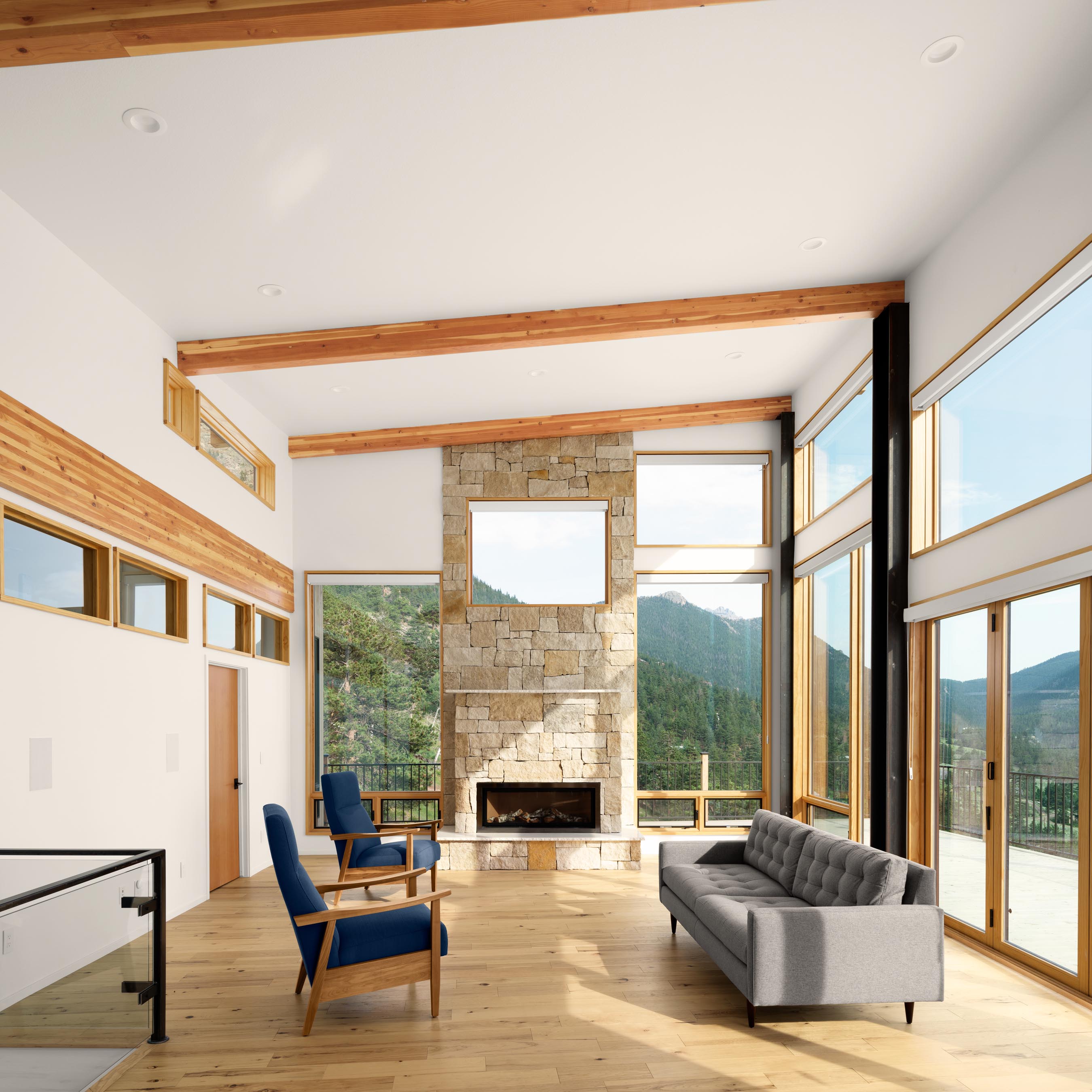 Residential architecture photography by Warren Diggles. 1 point perspective of minimal living room with mountain views. New home project by Bas1s Architecture.
