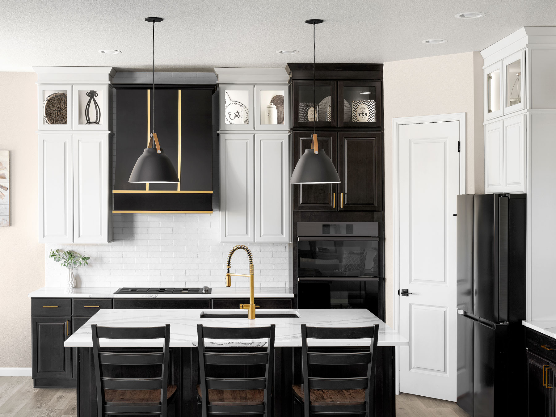 Residential branding photography by Warren Diggles. Modern black and gold kitchen by Windmill Homes